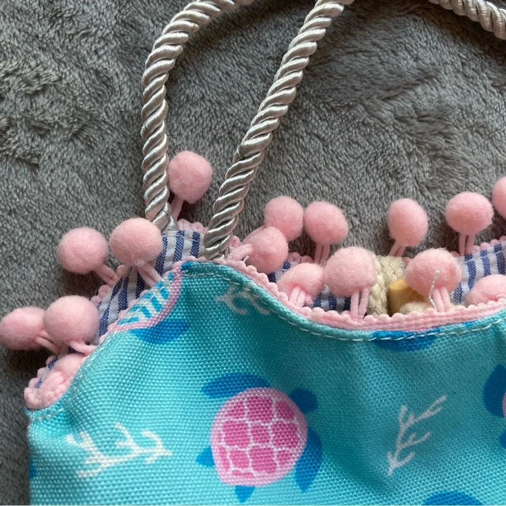 The Preppy Pelican Child's Bag by The Petting Zoo with Turtle Print & Pom Poms